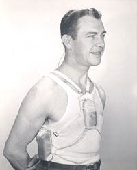 Male model wearing body aid hearing device and underarm battery harness