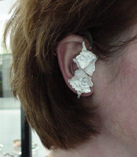 Contemporary hearing aid featuring abstract design