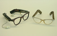 Examples of eyeglass hearing aids, 1950s